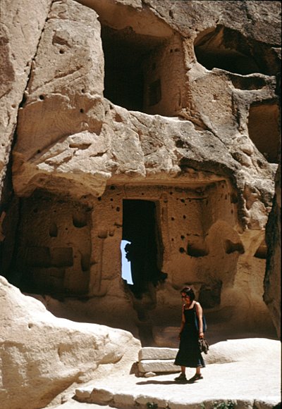 kapadokya rock dwellings with figure to give idea of scale.